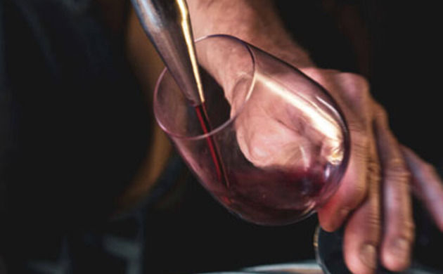 Pinot Noir being poured into a glass.