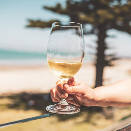 Hand holding a glass of wine