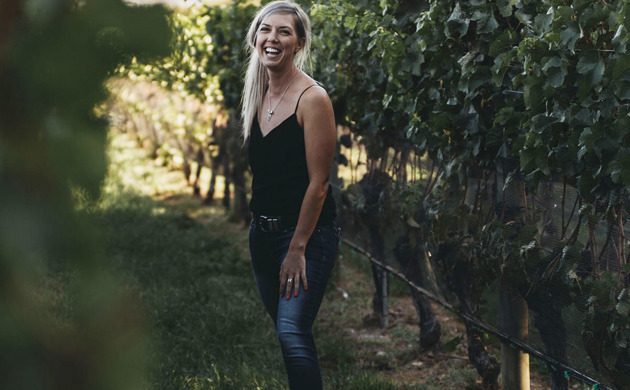 Alice Rule standing in vine rows