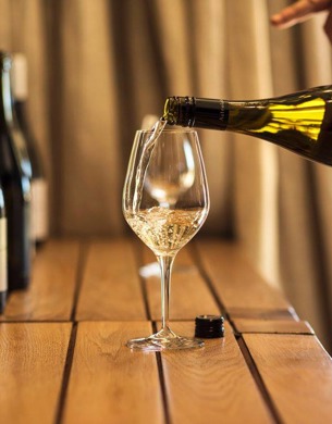 Sauvignon Blanc wine being poured into a glass.